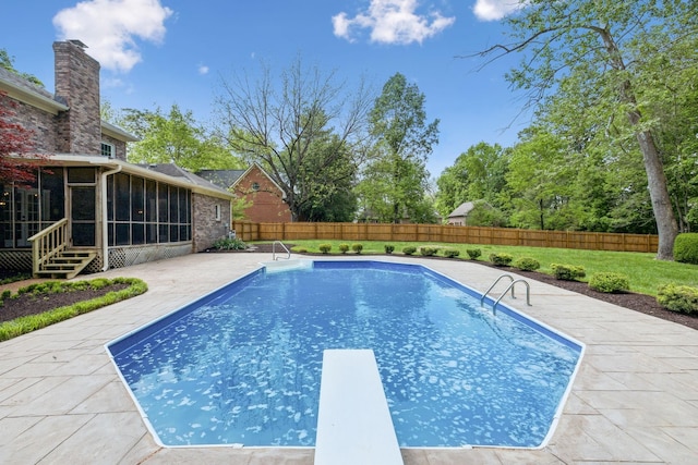 view of swimming pool with a fenced in pool, a fenced backyard, a sunroom, and a patio area