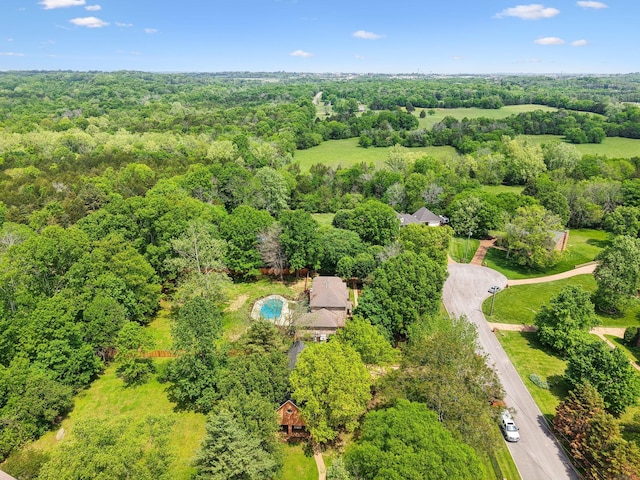 drone / aerial view with a view of trees