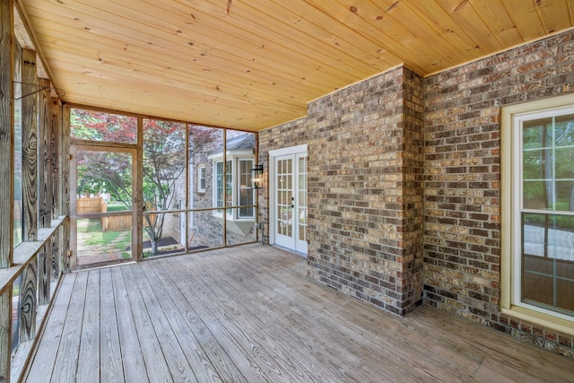 unfurnished sunroom with french doors