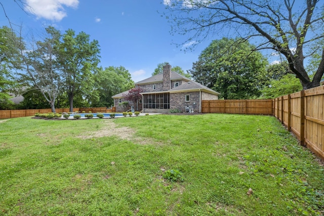 view of yard with a fenced backyard