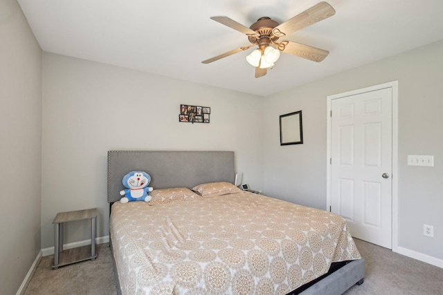 carpeted bedroom with baseboards and ceiling fan