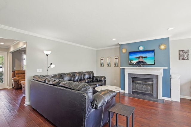living area with a fireplace with flush hearth, ornamental molding, hardwood / wood-style floors, and recessed lighting