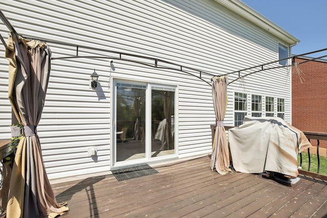 wooden terrace featuring grilling area