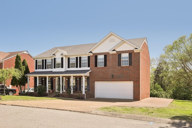 view of front facade featuring brick siding, an attached garage, a porch, and concrete driveway