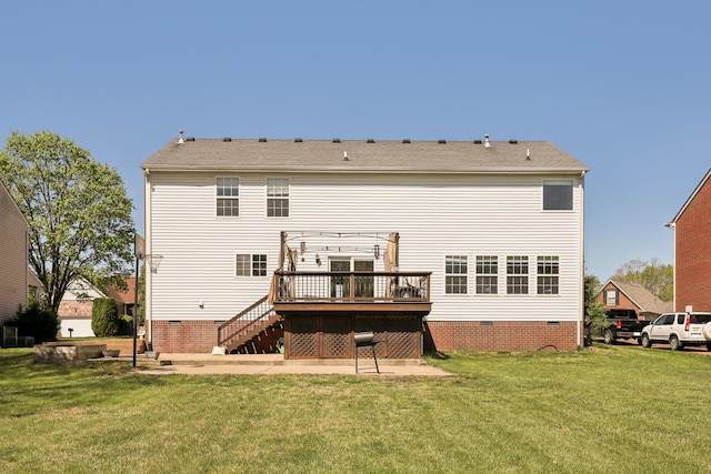 back of property with a lawn, a wooden deck, crawl space, and stairs