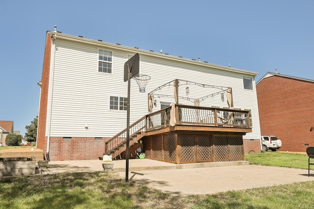 rear view of property with stairway, crawl space, a wooden deck, and a patio area