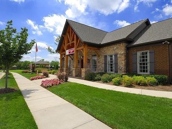 3728 Hoggett Ford Rd, Hermitage, TN 37076 - view of front of house with stone siding and a front lawn