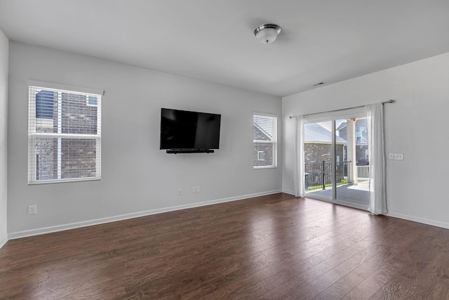 3728 Hoggett Ford Rd, Hermitage, TN 37076 - unfurnished living room featuring baseboards and dark wood-style floors