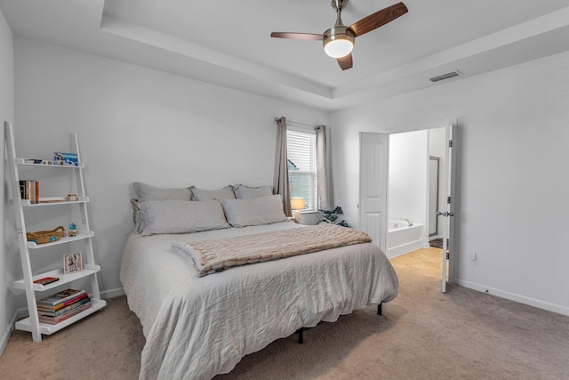 3728 Hoggett Ford Rd, Hermitage, TN 37076 - bedroom with a tray ceiling, baseboards, visible vents, light colored carpet, and a ceiling fan