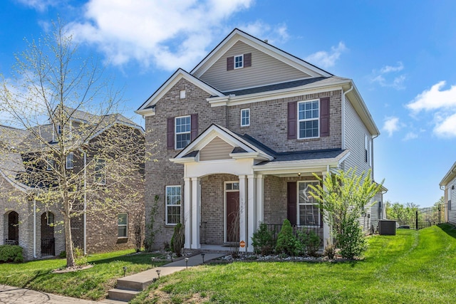 3728 Hoggett Ford Rd, Hermitage, TN 37076 - view of front of house with brick siding, a porch, central AC, and a front yard