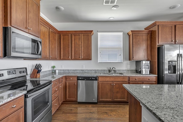 3728 Hoggett Ford Rd, Hermitage, TN 37076 - kitchen featuring dark wood finished floors, light stone counters, stainless steel appliances, and a sink
