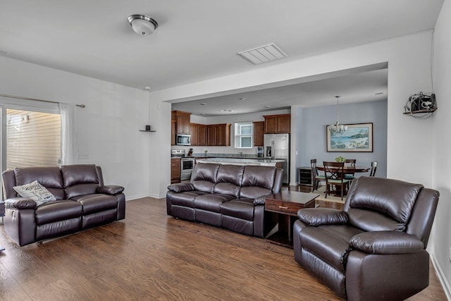 3728 Hoggett Ford Rd, Hermitage, TN 37076 - living area featuring dark wood-style floors, baseboards, and visible vents