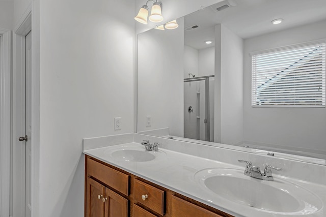 3728 Hoggett Ford Rd, Hermitage, TN 37076 - full bath featuring double vanity, a shower stall, visible vents, and a sink