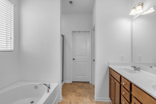 3728 Hoggett Ford Rd, Hermitage, TN 37076 - bathroom with a garden tub, a sink, visible vents, and double vanity