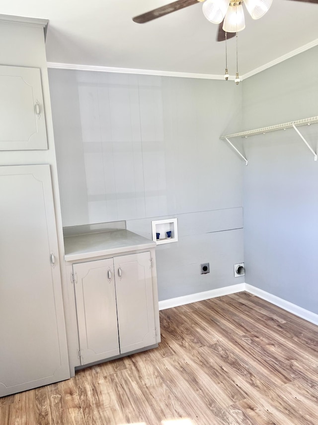 washroom featuring a ceiling fan, hookup for an electric dryer, cabinet space, light wood-style flooring, and washer hookup
