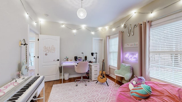 home office with wood finished floors