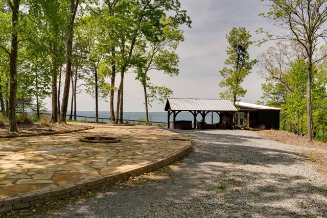 surrounding community featuring a water view