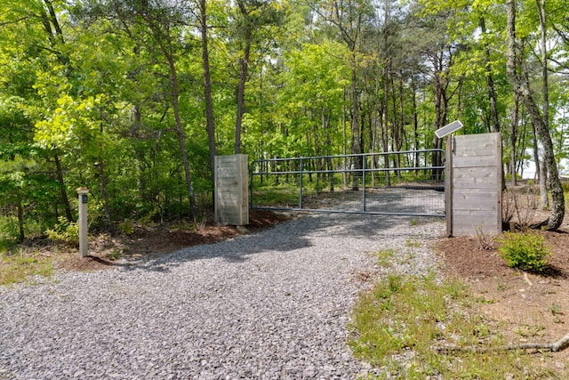 view of gate with fence