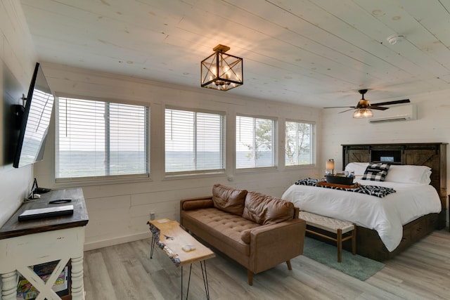 bedroom with wooden ceiling, baseboards, light wood finished floors, and a wall mounted AC