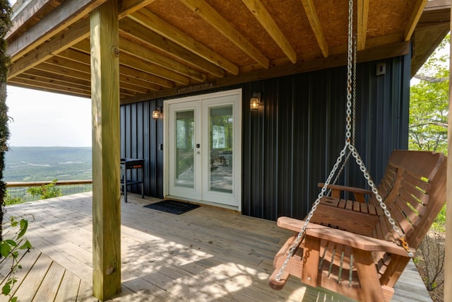 wooden deck featuring french doors