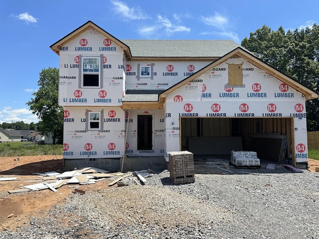 1229 Elizabeth Ln, Clarksville, TN 37042 - property in mid-construction featuring an attached garage, a shingled roof, and driveway