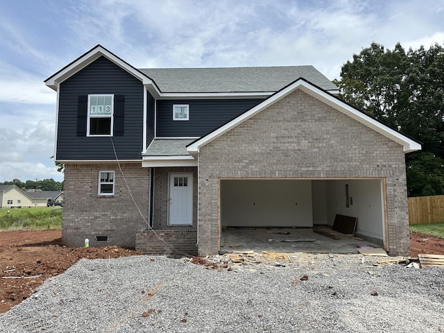 1229 Elizabeth Ln, Clarksville, TN 37042 - view of front of house with brick siding, a shingled roof, an attached garage, and gravel driveway