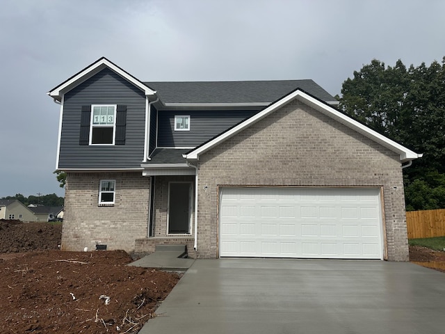 1229 Elizabeth Ln, Clarksville, TN 37042 - view of front of house featuring brick siding, driveway, an attached garage, and roof with shingles