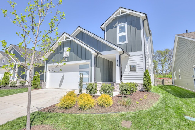 1084 Linn Cove Ct, Gallatin, TN 37066 - view of front of home featuring driveway, stone siding, an attached garage, board and batten siding, and a front yard