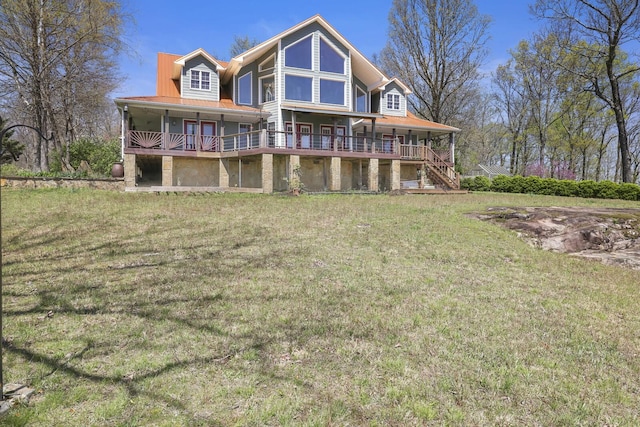 rear view of house featuring a porch, stairs, and a yard