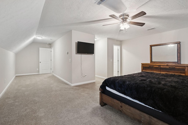 carpeted bedroom featuring visible vents, baseboards, and a textured ceiling