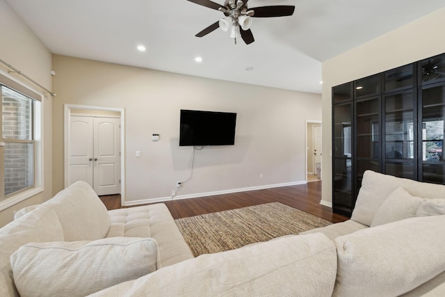 living area with ceiling fan, baseboards, wood finished floors, and recessed lighting