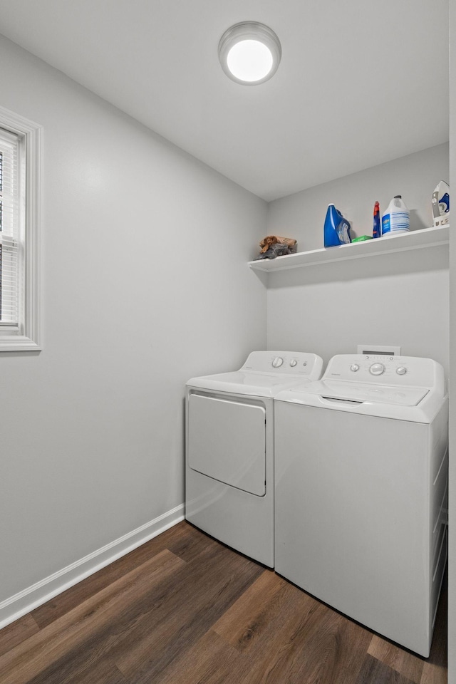 laundry room featuring dark wood-style floors, separate washer and dryer, laundry area, and baseboards