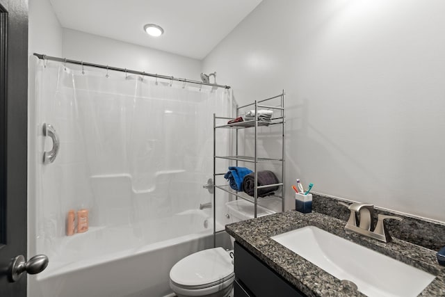 bathroom with shower / bath combo with shower curtain, toilet, and vanity