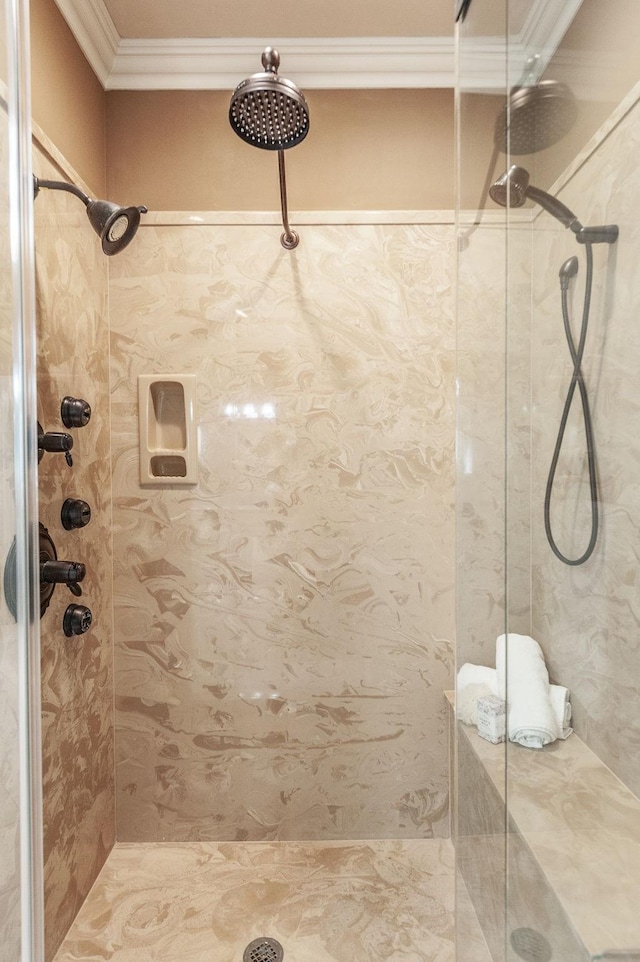 bathroom with crown molding and a stall shower
