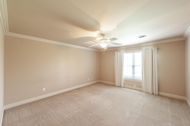 spare room featuring crown molding, ceiling fan, light carpet, baseboards, and visible vents