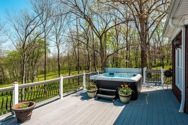 deck featuring a hot tub