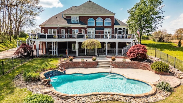 rear view of house with a fenced backyard, stairs, and a deck