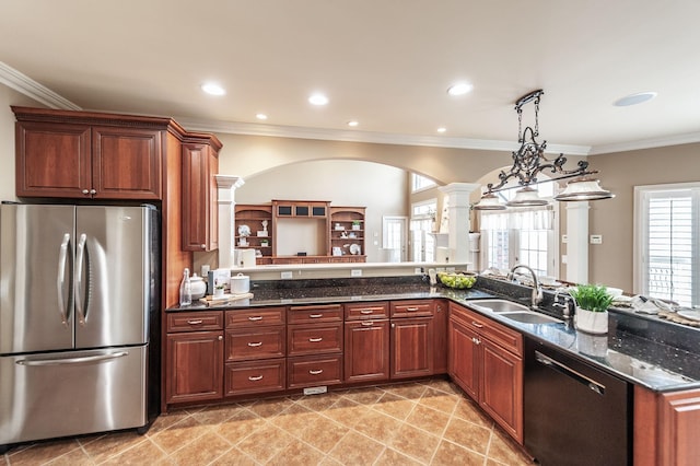 kitchen featuring a sink, decorative columns, freestanding refrigerator, crown molding, and dishwasher