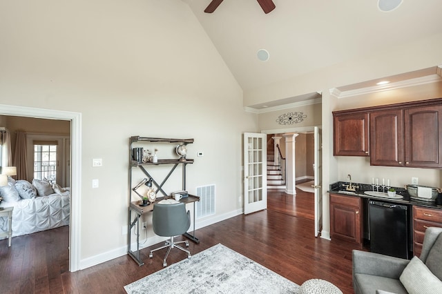 interior space with high vaulted ceiling, indoor wet bar, visible vents, and baseboards