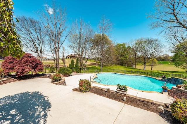 view of swimming pool with fence, a patio, and a fenced in pool