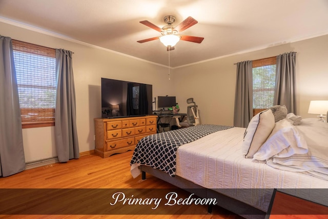 bedroom with a ceiling fan, baseboards, light wood-style floors, and ornamental molding