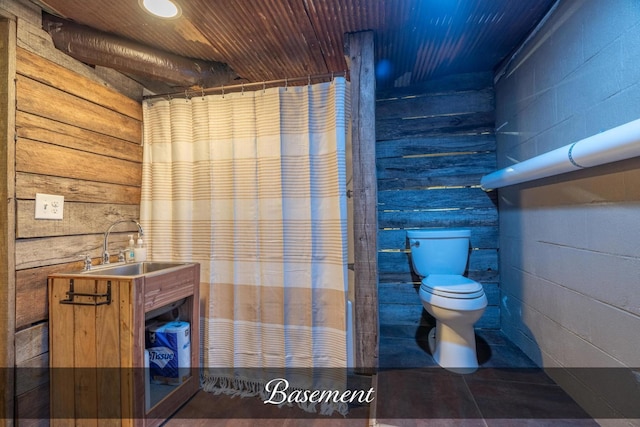 bathroom featuring tile patterned floors, vanity, and toilet
