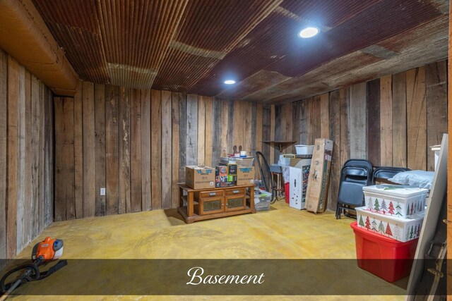 interior space with wood walls and recessed lighting