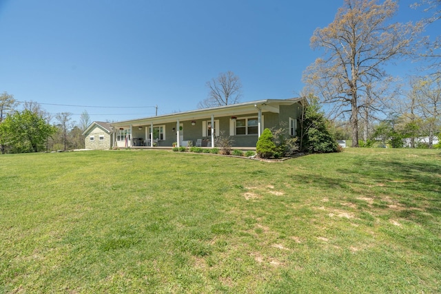 ranch-style house with covered porch, a front yard, and stucco siding