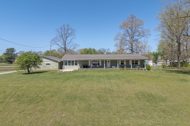 single story home with a porch and a front lawn