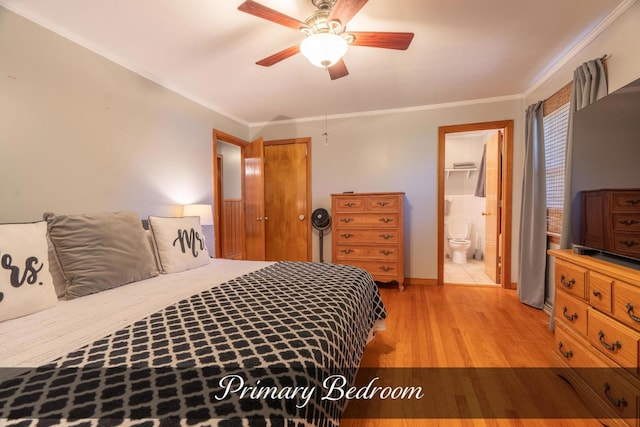 bedroom with ensuite bath, crown molding, light wood-style floors, and baseboards