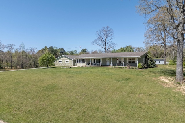 view of front facade featuring a front lawn and covered porch