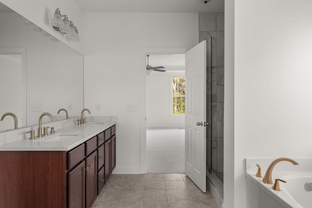 bathroom featuring a garden tub, a sink, double vanity, and a stall shower