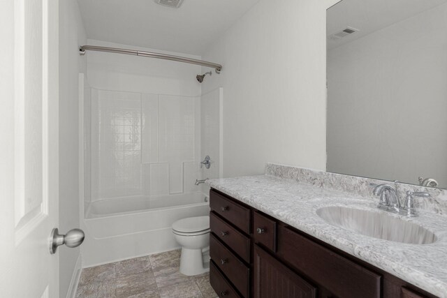bathroom featuring toilet, vanity, shower / tub combination, and visible vents