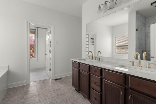 bathroom with visible vents, a sink, double vanity, and a stall shower